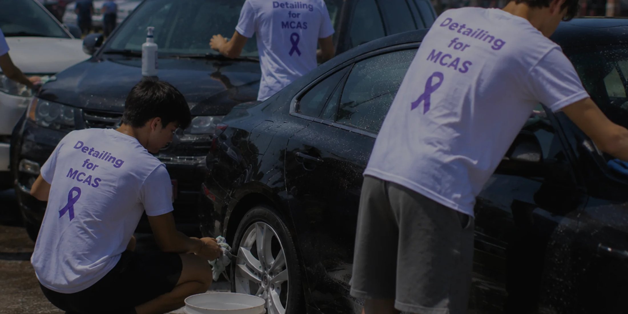 Detailing for MCAS volunteers detailing a car at a fundraising event