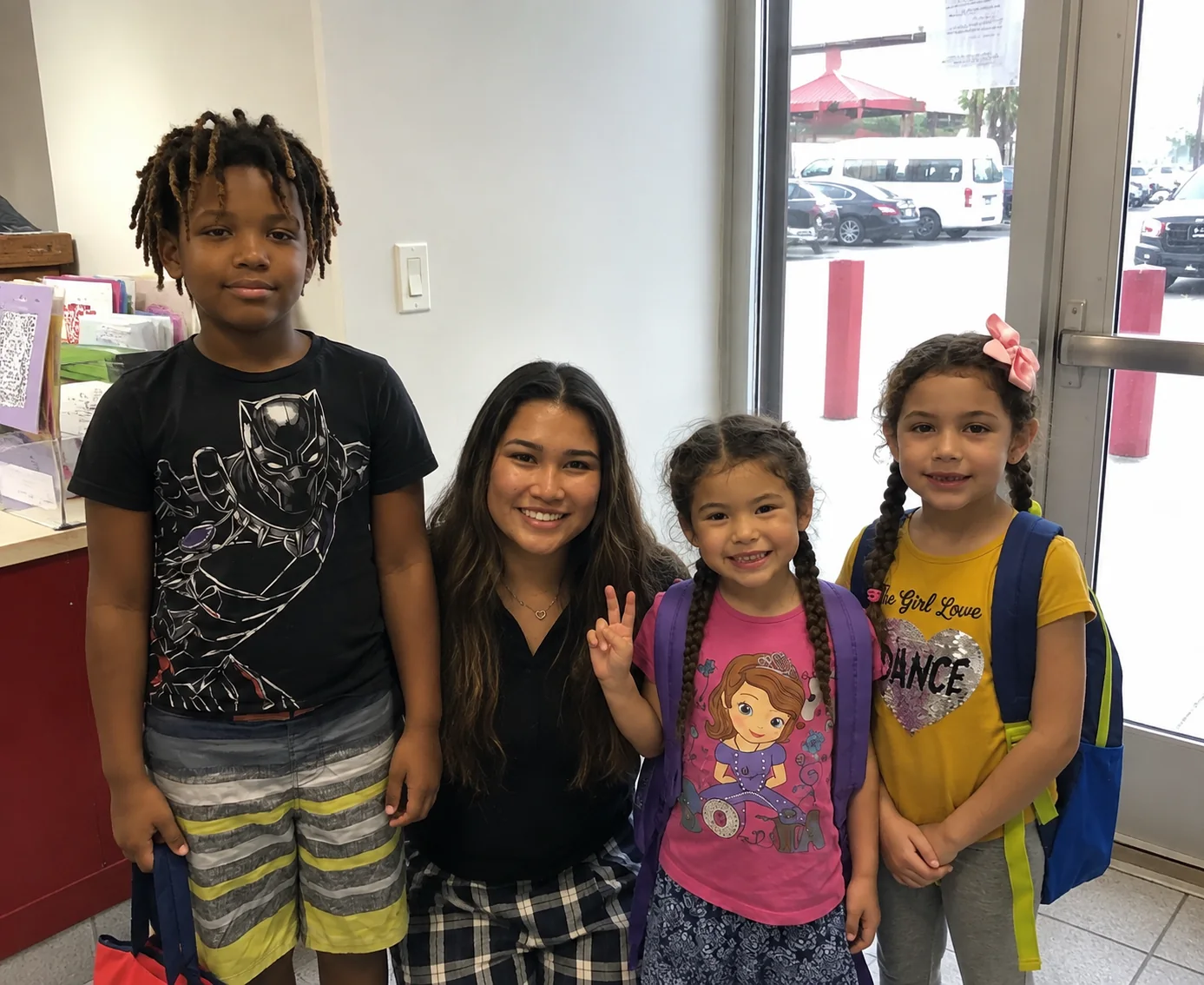 A Detailing for MCAS volunteer with children at a community outreach event